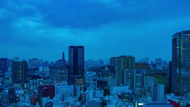 A dawn timelapse of the urban cityscape in Tokyo high angle wide shot zoom — ストック動画