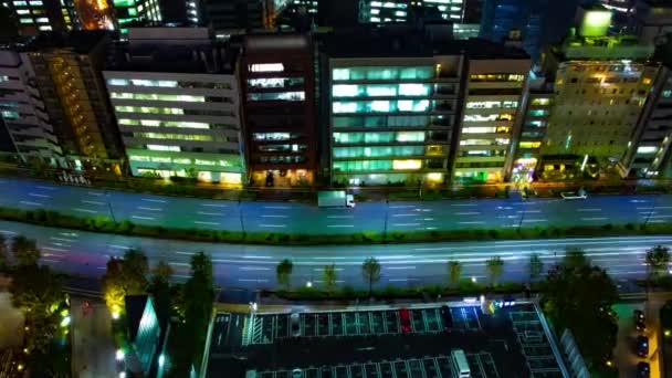 Un timelapse notturno della strada nella città urbana di Tokyo zoom grandangolare — Video Stock