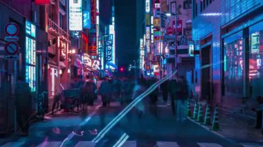 A night timelapse of the neon street at the downtown in Shinjuku Tokyo medium shot zoom
