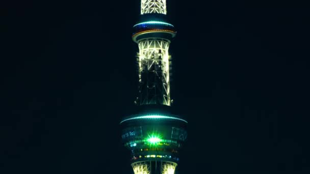 A night timelapse of Tokyo sky tree at the urban city in Tokyo long shot — 图库视频影像