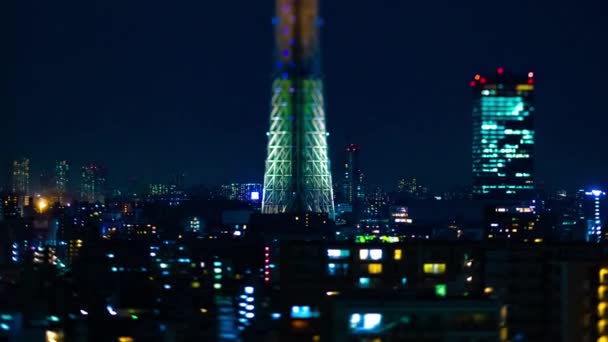 A night timelapse of Tokyo sky tree at the urban city in Tokyo tiltshift zoom — 图库视频影像