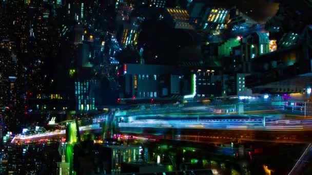 A night timelapse of the highway in Shibuya Tokyo high angle vertical shot panning — Stock Video