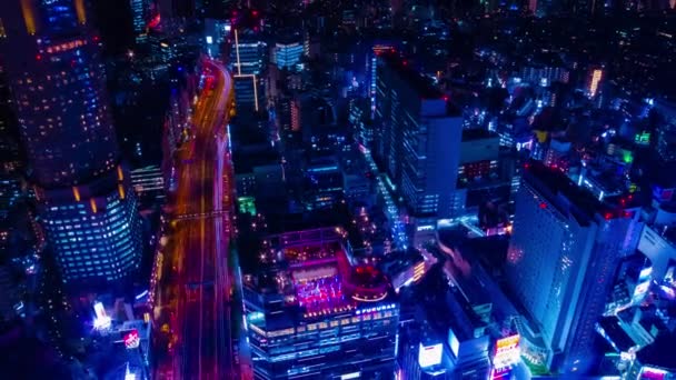 Ночной хронометраж неонового городка в Сибуя Токио с высоким углом стрельбы — стоковое видео