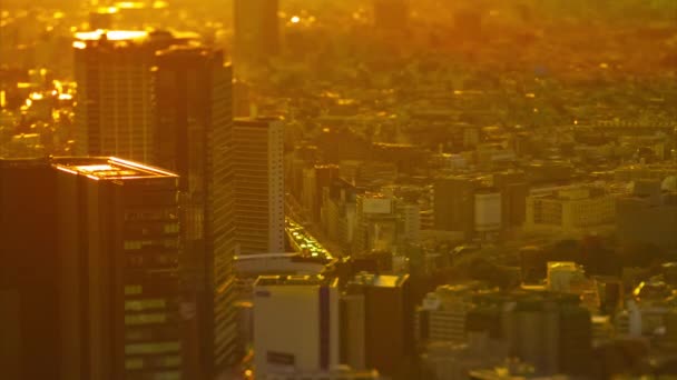 A sunset timelapse of miniature urban cityscape in Tokyo high angle tiltshift — Stock Video