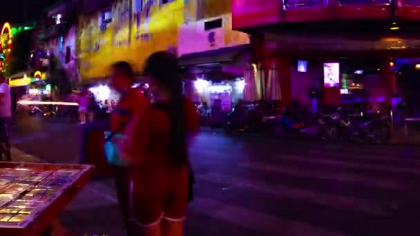 A night timelapse of the neon downtown at Bui Vien street in Ho Chi Minh Vietnam wide shot panning — Stock Video