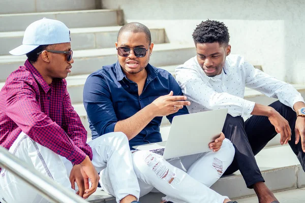 Group of many friends laughing out loud outdoor, sharing good and positive mood