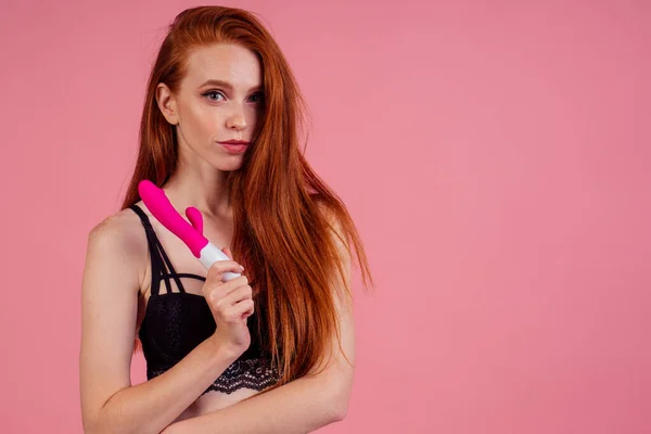 Redhaired ginger woman with sex self clit and vagina stimulation and wearing black lace bra and underpants in studio pink background — Stock Photo, Image