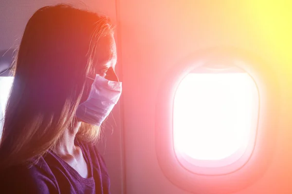 woman feeling bad in aeroplane fly afraid
