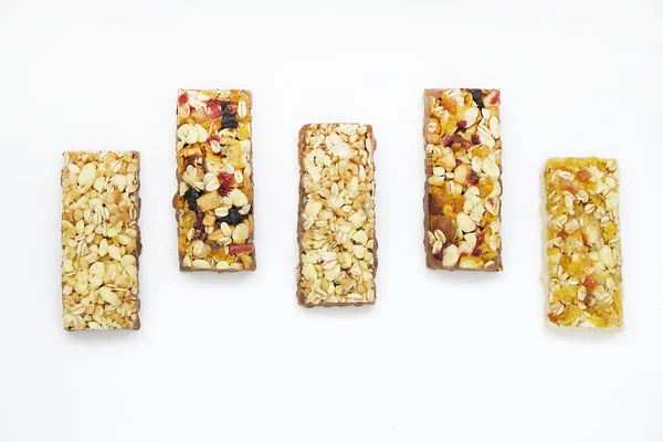 Healthy cereal bars on texture table, with copy space top view