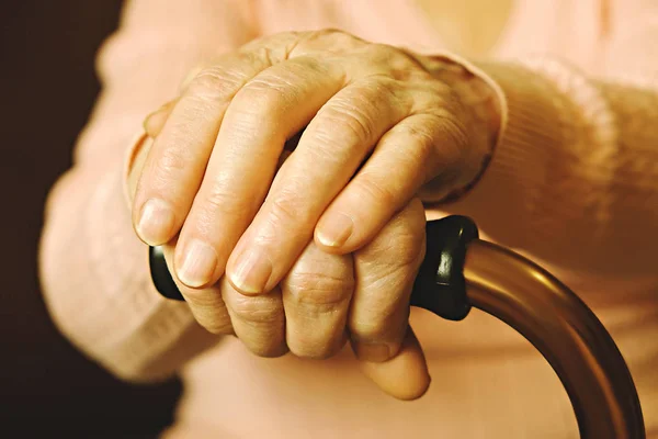 Close up of mature womans hands. Health care giving, nursing home. Parental love of grandmother. Old age related diseases. — Stock Photo, Image