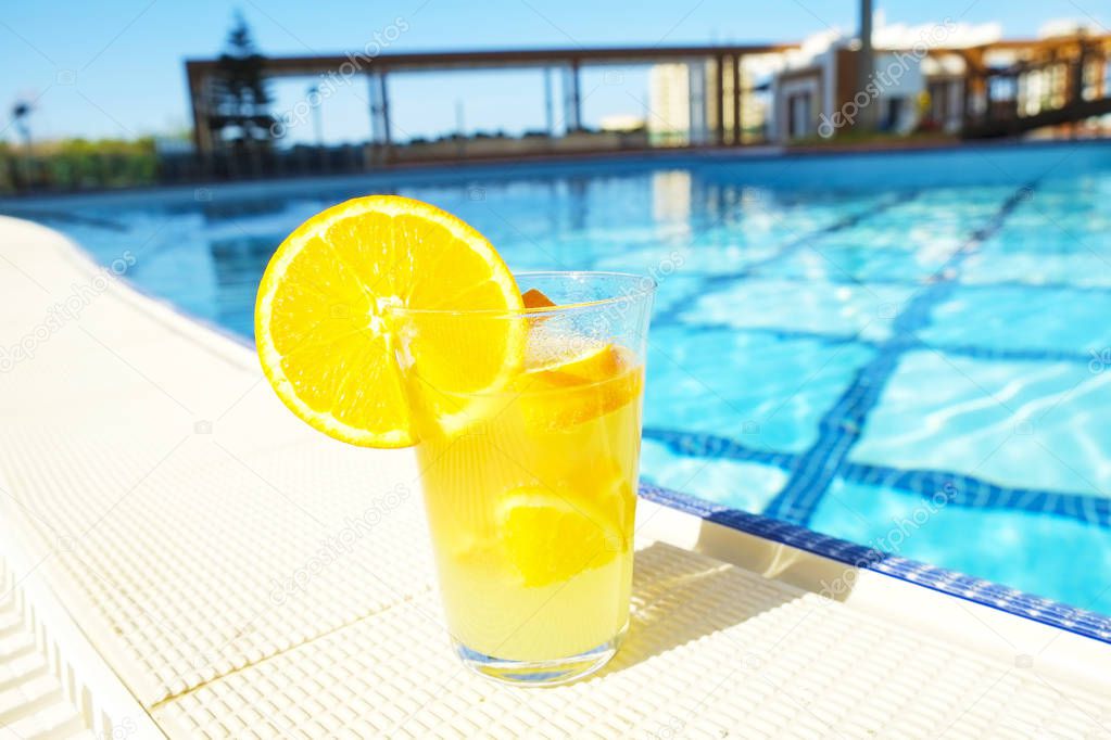 Poolside composition with orange 