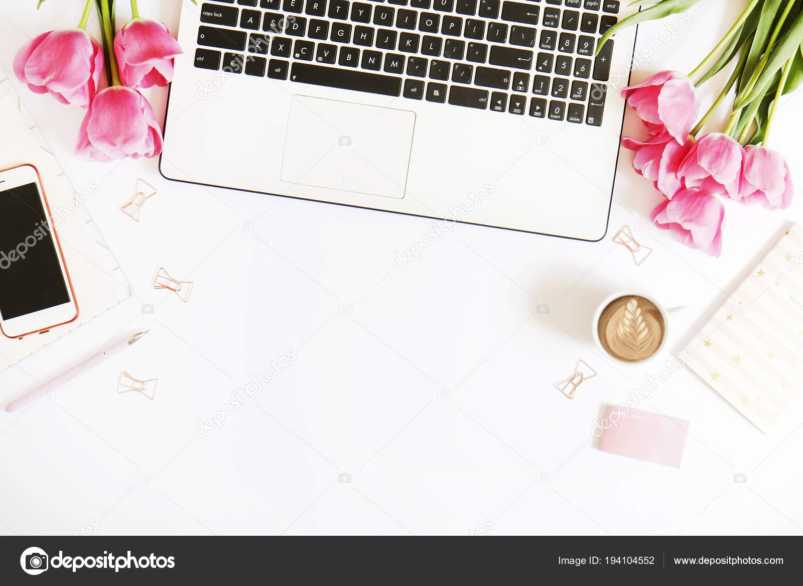 Top View Of Female Worker Desktop With Laptop Flowers And
