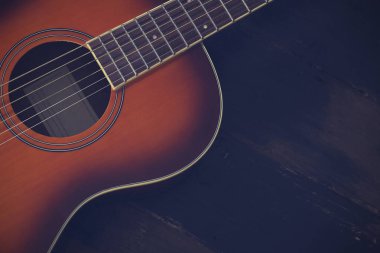 Eski ahşap arka planda altı telli folk akustik gitar..