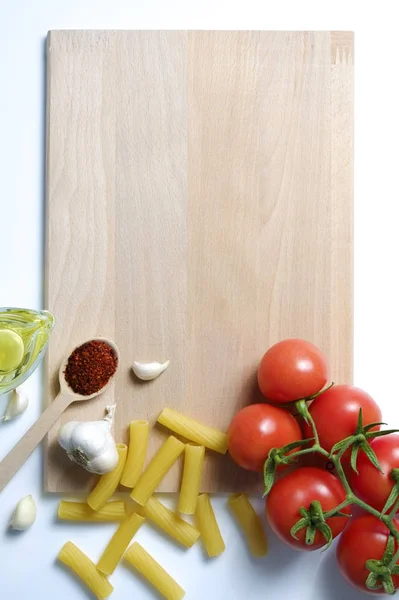 Top view of mixed vegetables on white countertop. Vegan dieting food.