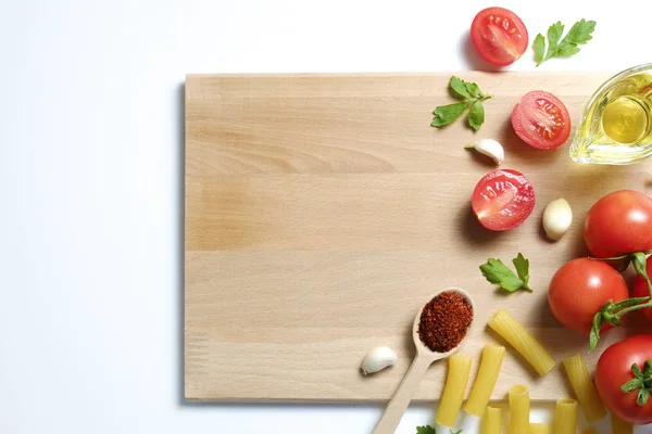 Top view of mixed vegetables on white countertop. Vegan dieting food.