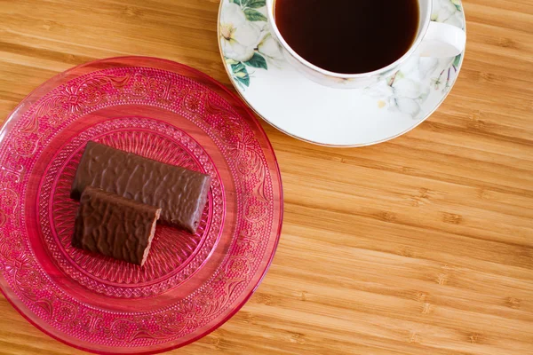 Cup of coffee and chocolate sweets — Stock Photo, Image