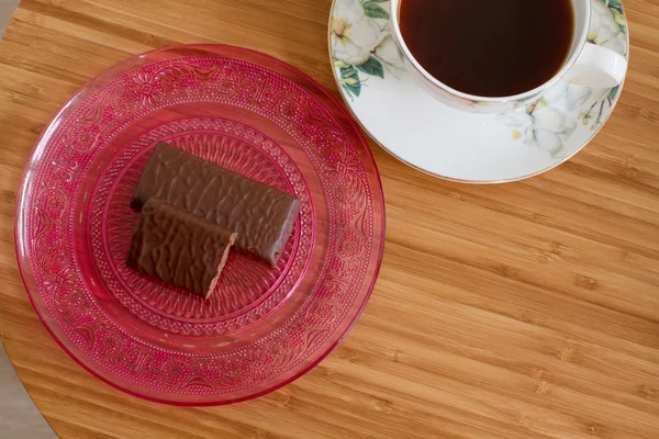 Taza de café y dulces de chocolate —  Fotos de Stock