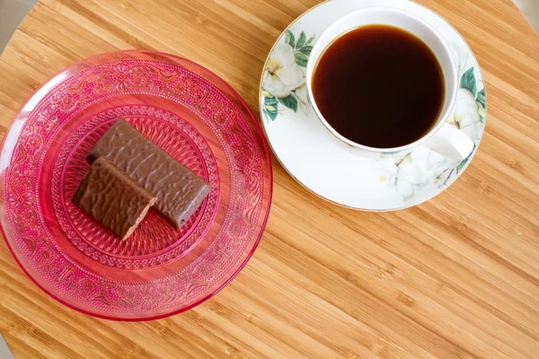 Cup of coffee and chocolate sweets — Stock Photo, Image