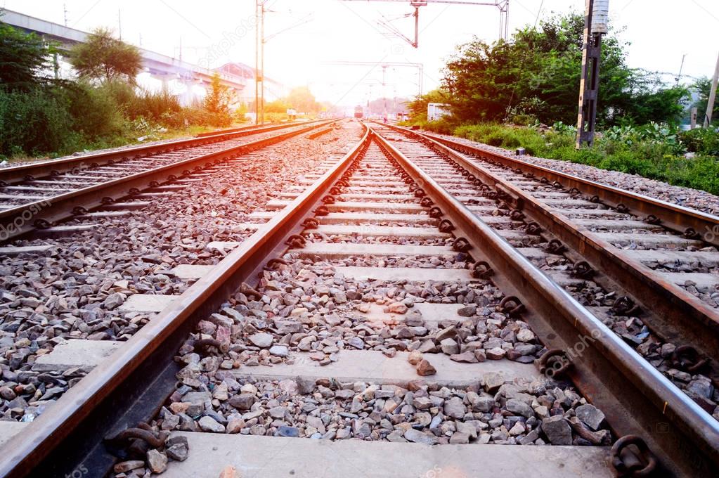 Railroad track at the time of sunset.