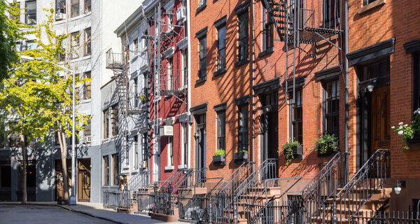 Panoramic view of colorful row of old buildings along Gay Street in the Greenwich Village neighborhood of Manhattan, New York City NYC