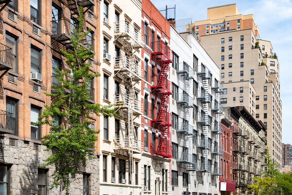 Block of colorful old apartment buildings in the East Village of Manhattan, New York City NYC