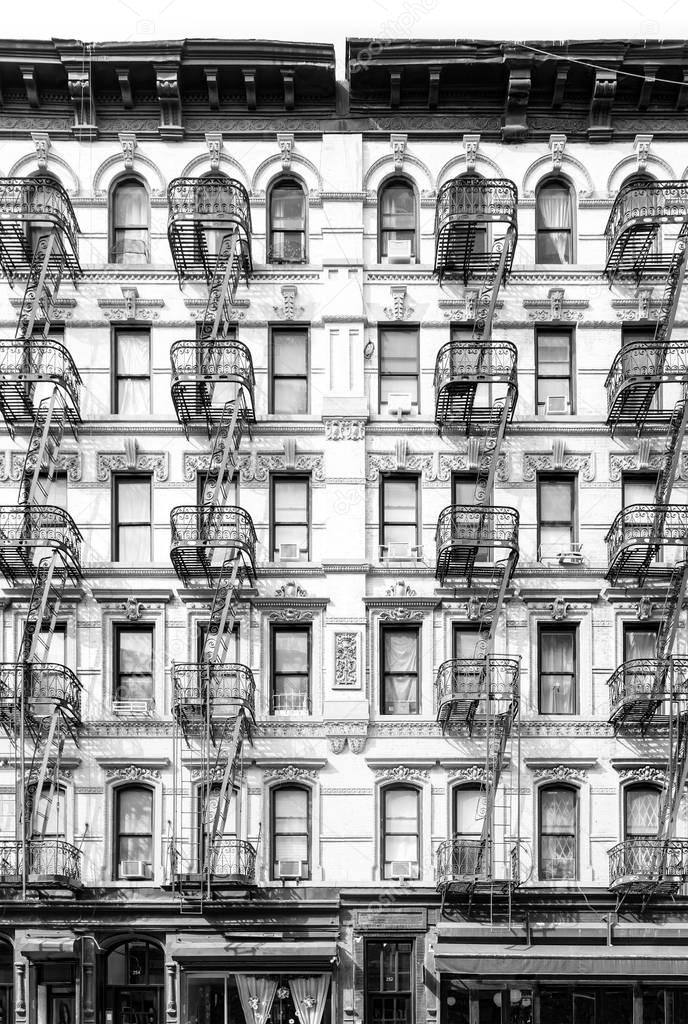 New York City vintage apartment building with windows and fire e