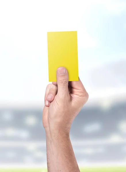 Yellow Card On Stadium Background — Stock Photo, Image