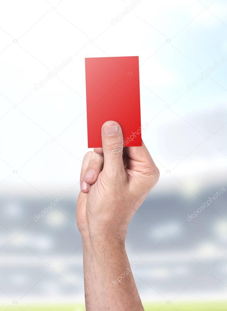 Red Card On Stadium Background