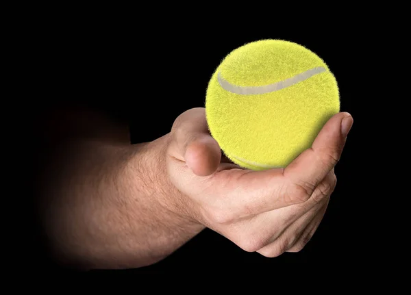 Mano sosteniendo pelota de tenis — Foto de Stock