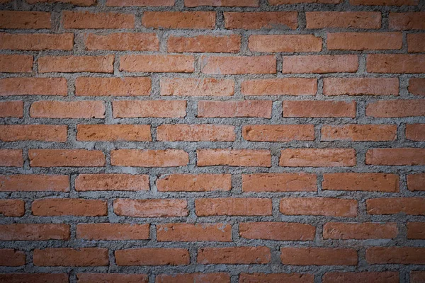 red brick wall texture grunge background with vignetted corners, may use to interior design. as background interior decoration concept with copy space.