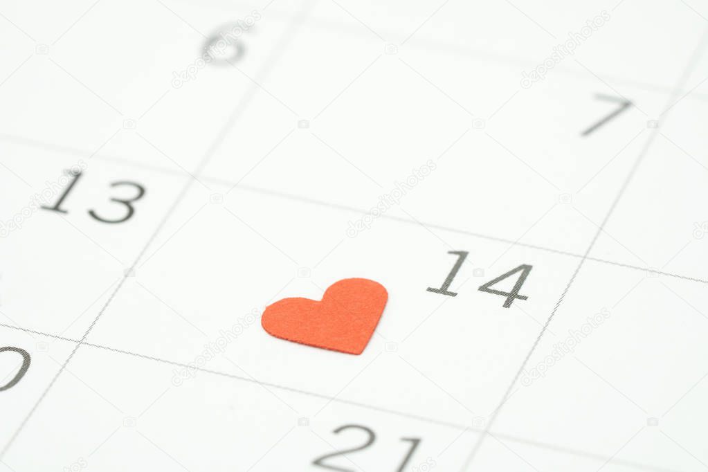 Calendar. Day 14 meets Valentine Day with Heart shaped red paper. Red heart is the promise of love. using as background Valentine concept with copy spaces for you