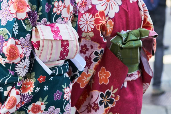 Young girl wearing Japanese kimono standing in front of Sensoji