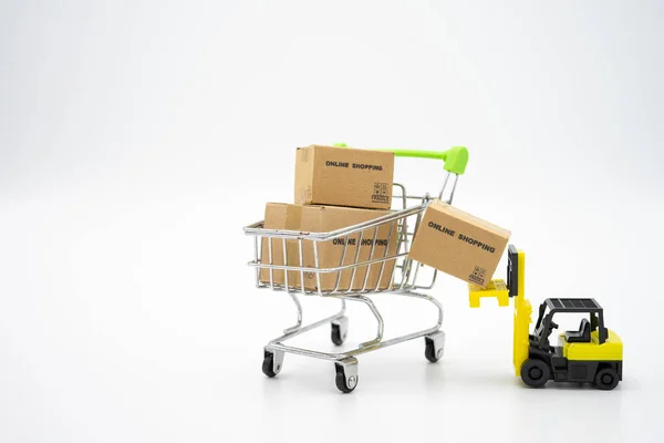 Online shopping with a shopping cart and shopping bags delivery — Stock Photo, Image