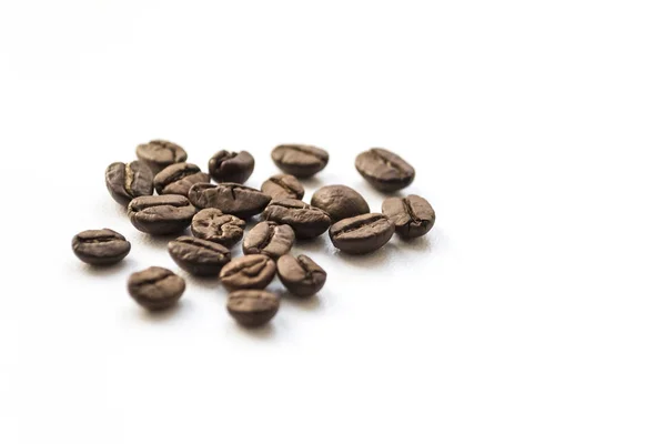 Coffee beans on white table — Stock Photo, Image