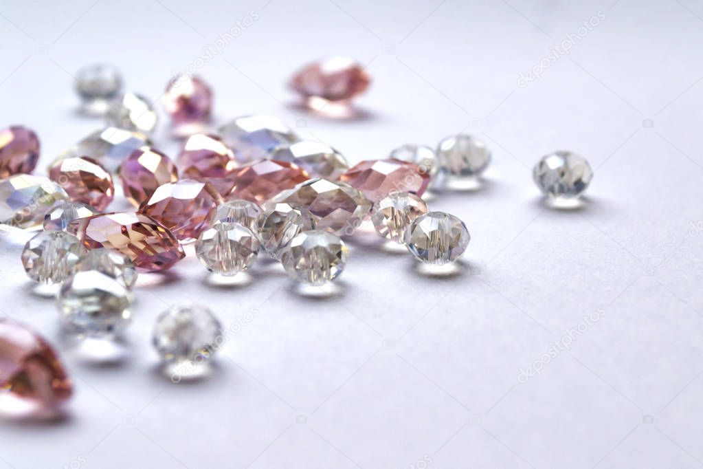 Crystal beads on white background. Closeup shot