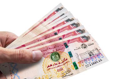 Birleşik Arap Emirlikleri'nin el tutan dirhemleri. Aed. Para birimi 