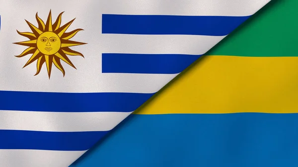 乌拉圭和加蓬两国国旗 高质量的商业背景 3D说明 — 图库照片