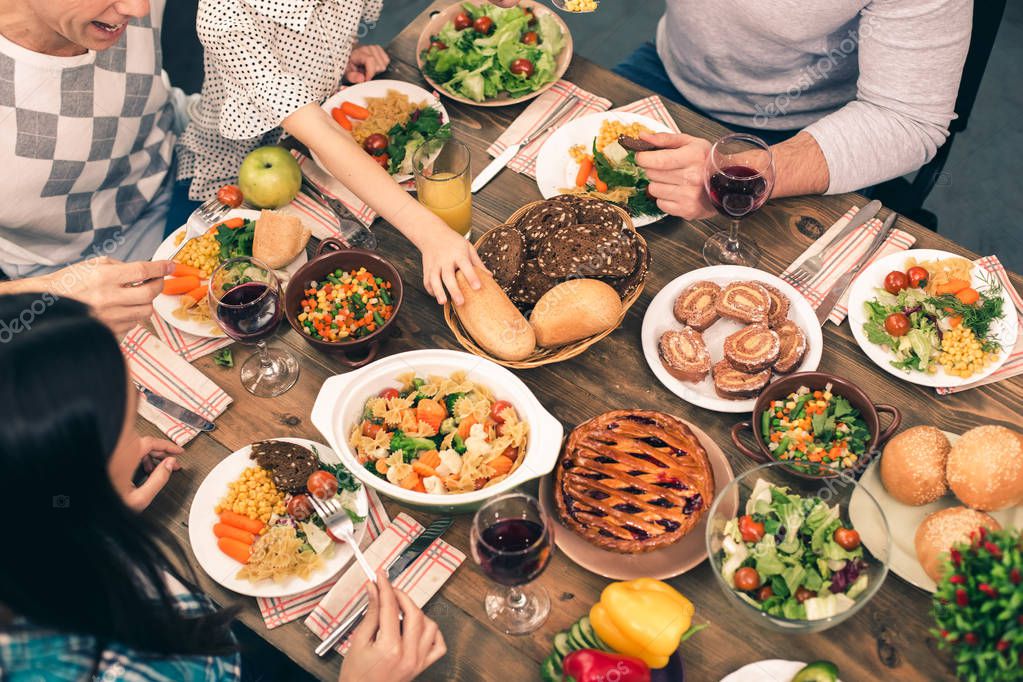 Nice family having tasty dinner — Stock Photo © dima_sidelnikov #148512483