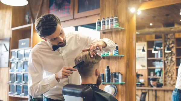 Young Man in Barbershop Hair Care Service Concept