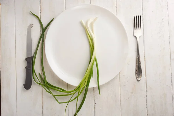 plate with greens on the blackboard