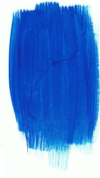 En blå färg sandskädda på ett vitt papper. Konstnärliga element. — Stockfoto