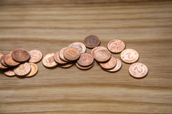 Old Latvian coins on a wooden background — Stock Photo, Image