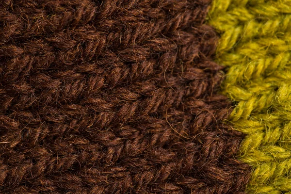 A beautiful closeup of a hand knitted warm and soft wool pattern. Soft socks or scarf of natural wool. Colorful pattern. — Stock Photo, Image