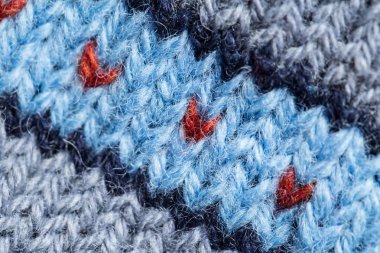 Bir el örme sıcak ve yumuşak yün desen güzel bir portre. Yumuşak çorap ya da doğal yün atkı. Renkli desen.