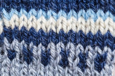 Bir el örme sıcak ve yumuşak yün desen güzel bir portre. Yumuşak çorap ya da doğal yün atkı. Renkli desen.