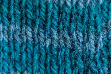 Bir el örme sıcak ve yumuşak yün desen güzel bir portre. Yumuşak çorap ya da doğal yün atkı. Renkli desen.