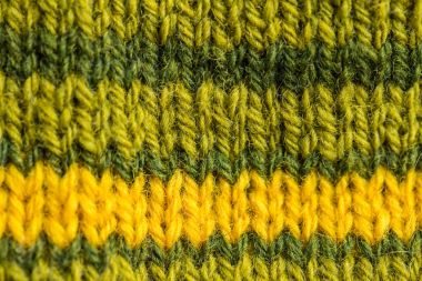 Bir el örme sıcak ve yumuşak yün desen güzel bir portre. Yumuşak çorap ya da doğal yün atkı. Renkli desen.