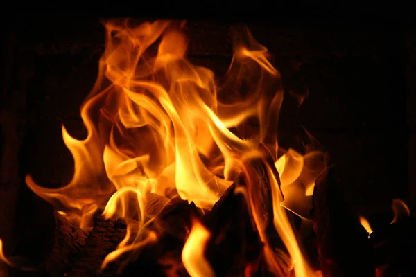 Fire burning inside a brick stove - wood, ash, flames. — Stock Photo, Image
