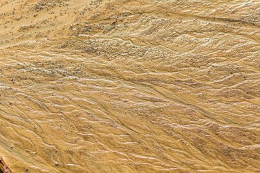 Güzel kum desenler Baltık Denizi kıyısında. Soyut, renkli arka plan kum plaj. Sığ derinlik-in tarla.