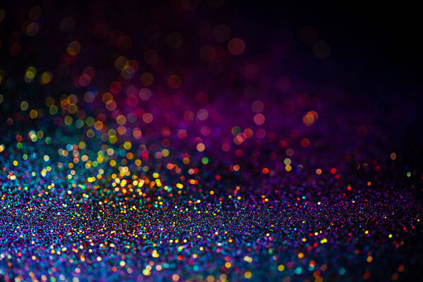 Shiny multicolor glitter raster background. Abstract shimmering pink, blue, yellow circles decorative backdrop. Bokeh lights effect illustration. Overlapping glowing and twinkling spots.
